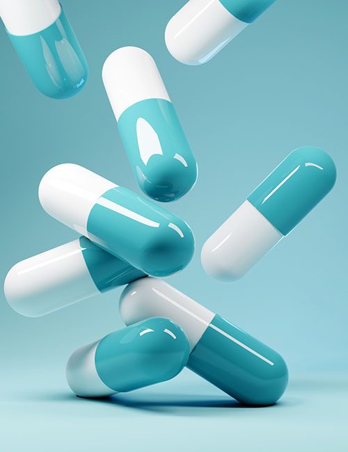 A group of antibiotic pill capsules fallling. Healthcare and medical 3D illustration background.